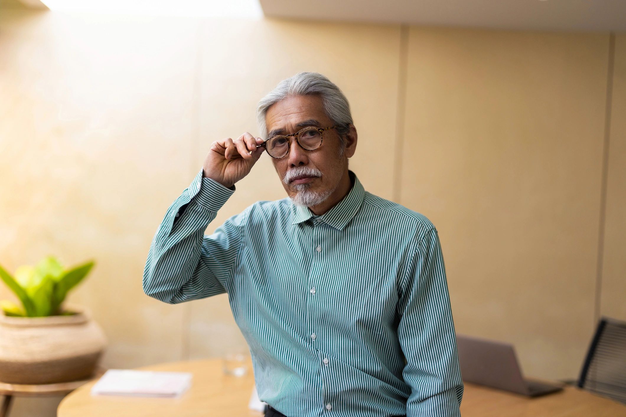 Thoughtful adult in a calm office setting