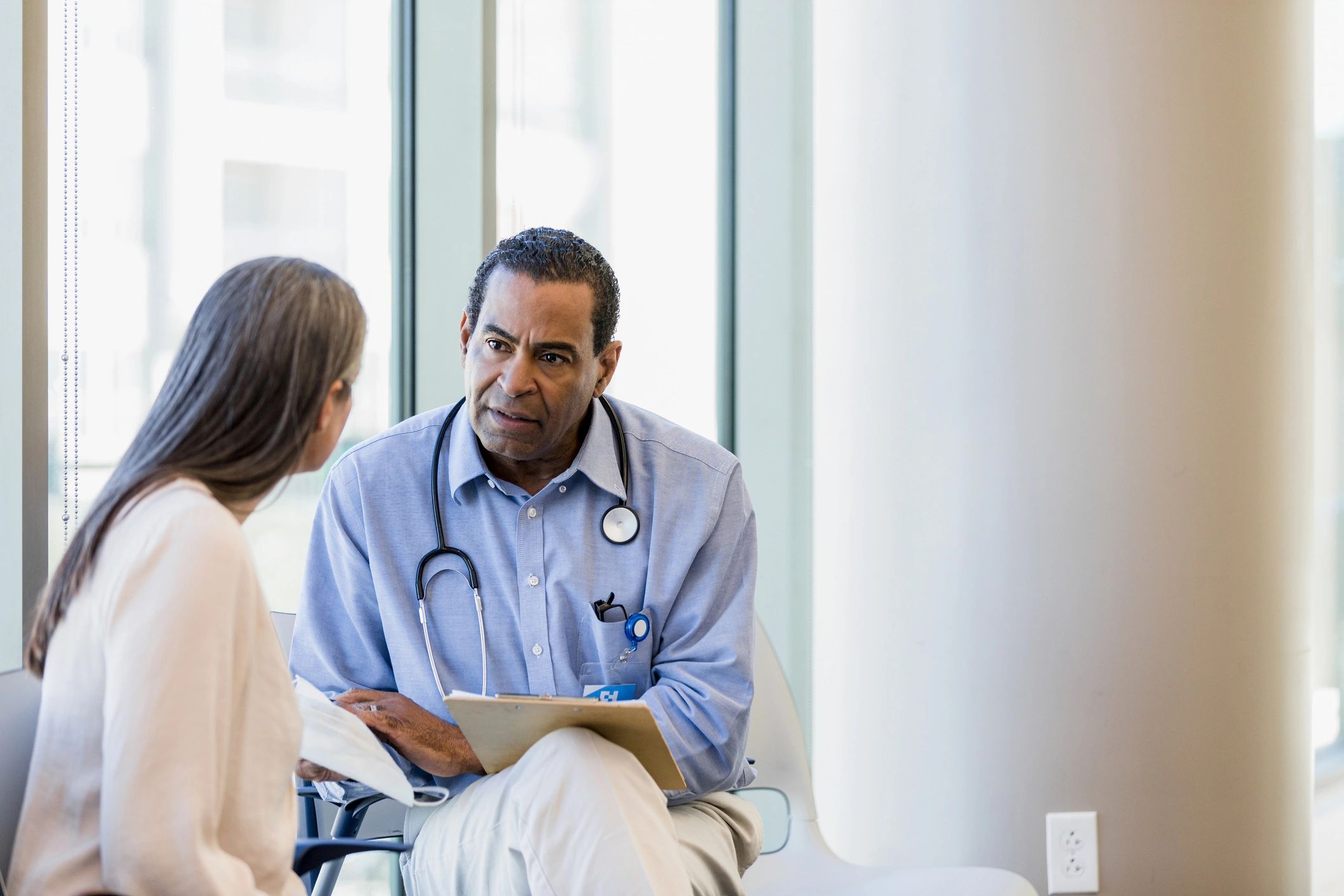 Doctor listening attentively to a patient
